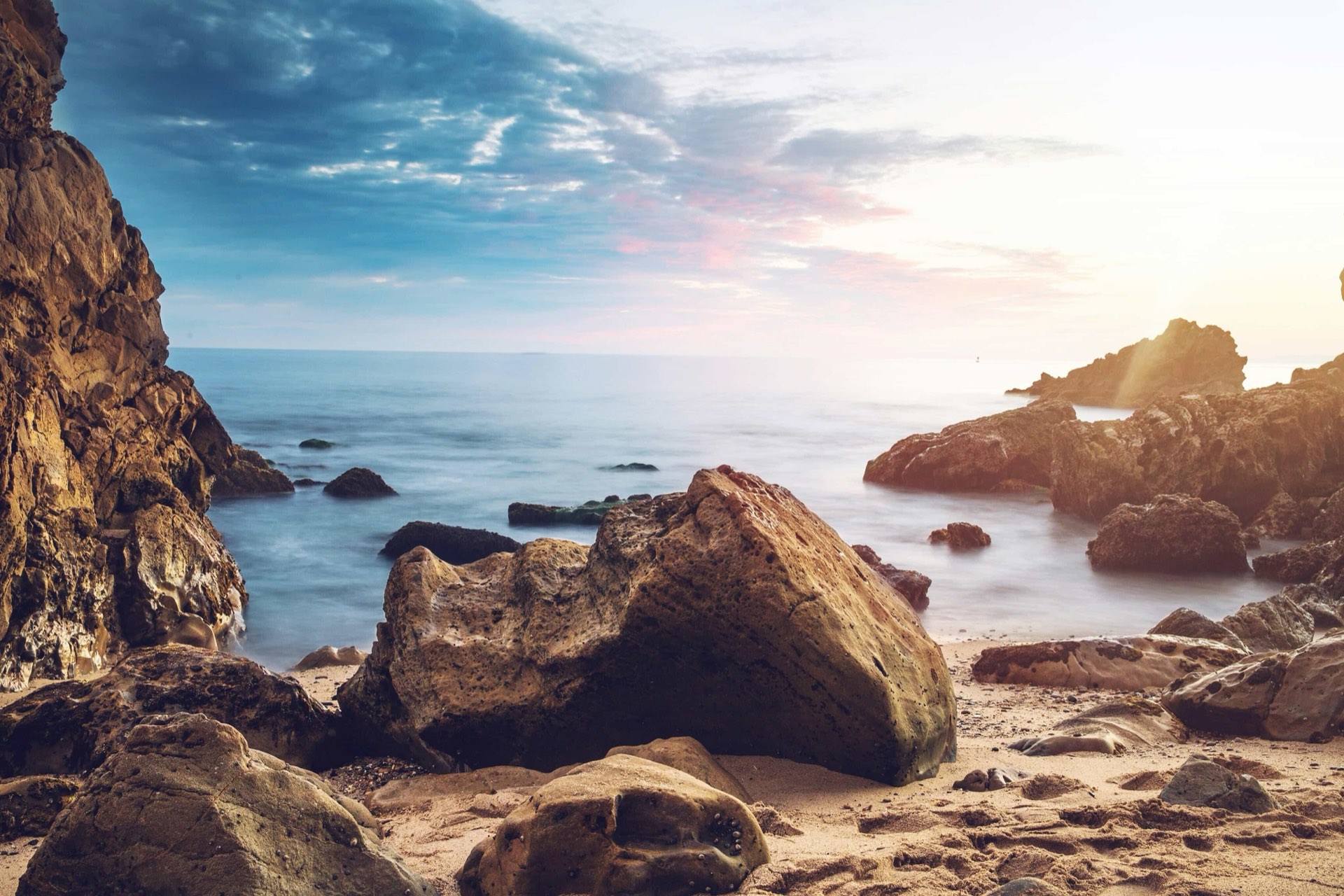 Rugged rocky coastline glowing at sunset